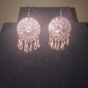 Brass colored pierced earrings.  Round w/dangles